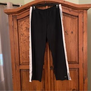 Nike black with white side seams track pants.   L 12/14